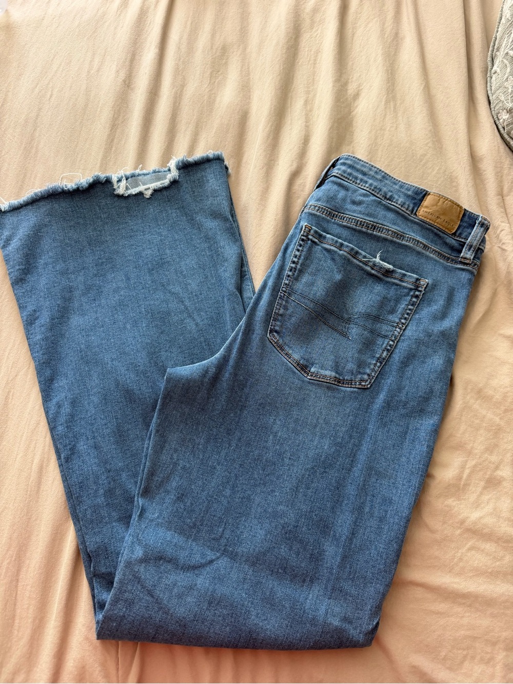 American Eagle Outfitters Mid-Rise Blue Flared Jeans with Raw Hem